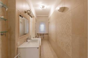 a bathroom with a sink and a mirror at Armea Suite Apartment in Trani +63 photos