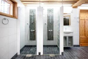 a bathroom with a shower and a sink at Lapland Dream Villas in Rauhala +92 photos