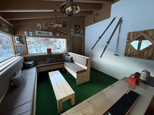 a living room with a couch and a table at Haus Dienten Apartments nahe den Bergbahnen mit HochkönigCard in Dienten am Hochkönig