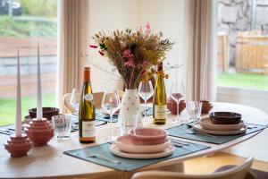 a table with wine bottles and glasses on it at Rodern - Le Cocon des vignes in Rodern