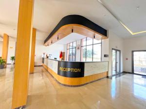an empty lobby with a reception counter in a building at Great Holiday suites in Agadir +24 photos