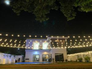 a white building with lights on top of it at Lindelle Place Palawan in Puerto Princesa City