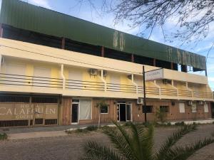 a building with a sign on the front of it at Calafquén in San Antonio Este