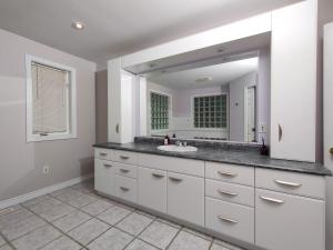 a bathroom with a sink and a mirror at Muskoka 4-Bedroom Cottage in Port Carling +53 photos