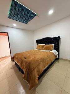 En eller flere senge i et værelse på Cabañas Casa Campo Guatavita