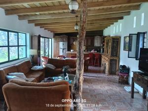 a living room with couches and a table at Casa ixcanul in Montitlán