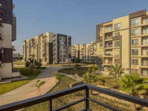 a view of apartment buildings from a balcony at 407. Spacious 3BR Apt. 2 Baths Gated Community in Sheikh Zayed