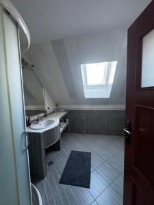 a bathroom with a sink and a mirror at Spokój u Zosi in Stare Bystre