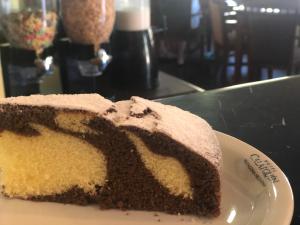 a piece of cake on a plate on a table at Calafquén in San Antonio Este
