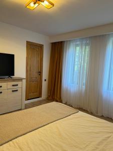 Et tv og/eller underholdning på Divine moments apartment@Calbucet ski slope