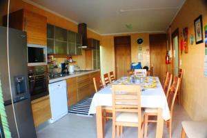 een keuken met een tafel en stoelen in een keuken bij Exceptional villa in Vila Franca Do Campo with private pool in Vila Franca do Campo