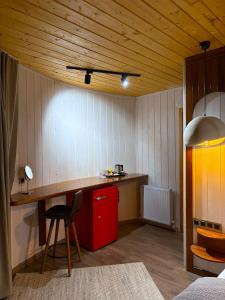 a kitchen with a desk and a red cabinet at Dream River Sapanca in Sapanca