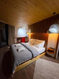 a bedroom with a large bed in a wooden room at Dream River Sapanca in Sapanca