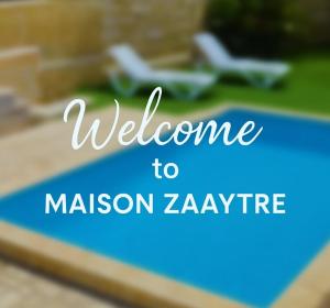 a sign that says welcome to mason zavre at Zaaytre house in Ḩayy al Mukhabbaʼ +5 photos