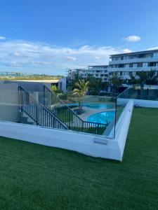 a view of a swimming pool from a building at Pebble Beach Sibaya 146 in Sibaya