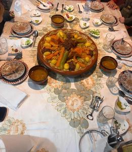 a table with a plate of food on it at dar ben issa in Fez