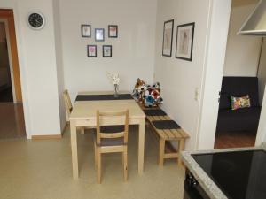 a dining room table and chairs in a room at Ferienwohnung Billich in Bad Bellingen