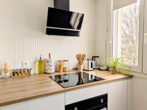 a kitchen with a counter top with a stove at Yutz and Zen in Basse-Yutz