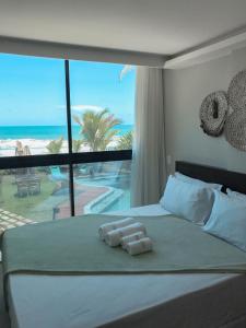 Giường trong phòng chung tại Rudá Boutique Hotel Porto de Galinhas