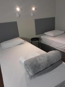 Giường trong phòng chung tại Pousada Três Garças +11 ảnh