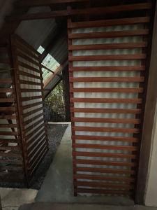 a view of a wooden wall in a house at Estudio Embira - Lago Verde in Santarém