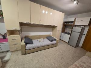 a room with a dog laying on a bed at City Center Piazza Studio in Tirana +6 photos