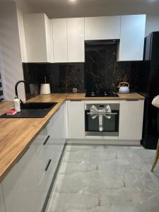 Køkken eller tekøkken på Apartament Ostrowiec Świętokrzyski + 5 billeder