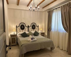 a bedroom with a bed and a window at Tenuta Fiumara in Marina di Grosseto +196 photos