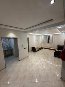an empty living room with a large room with a couch at Saad's villa in Mohammedia