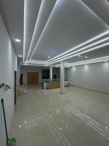 a large room with white walls and a white ceiling at Saad's villa in Mohammedia +2 photos