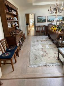 a living room with a table and a dining room at Elegant suite-30 day minimum in Carmel
