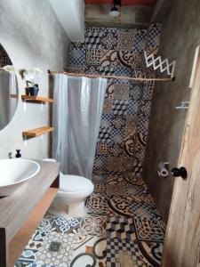 a bathroom with a shower and a toilet and a sink at HELEN HOUSE Bello Horizonte in Santa Marta +32 photos