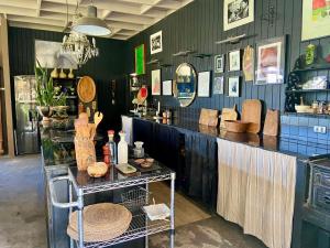 a store with a counter with hats and baskets at Cajanegra in El Cerrillo +22 photos