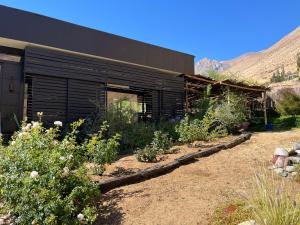 a black building with plants in front of it at Cajanegra in El Cerrillo