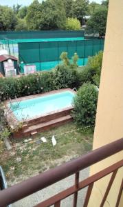a swimming pool in front of a building at Casa venturini in Imola