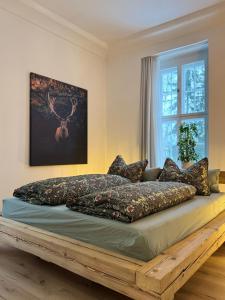 a large bed in a room with a window at Waldquartier Erzgebirge in Thermalbad Wiesenbad