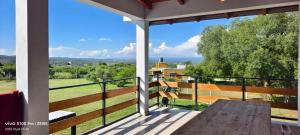 a balcony with a view of a field at DUPLEX Stadium in Tanti
