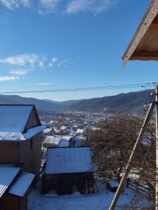 a view from the roof of a house in the snow at Микуличин на долоні 2 in Mykulychyn