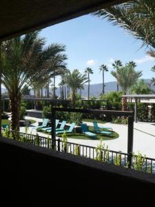 a view from the balcony of a resort with palm trees at Econo Lodge Lake Elsinore Casino in Lake Elsinore