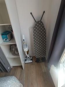 a bedroom with a room with a bed and a baseball bat at T2 Cosy 20 min Paris in Bezons +8 photos