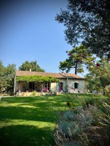 a house with a large yard with a green field at N&L Signature - Chambre d'hôtes in Mornas