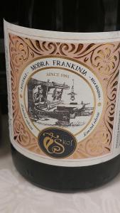 a bottle of wine with a label on it at Domačija Vesel in Trebnje