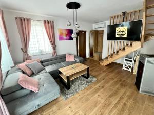 a living room with a couch and a table at Odskocznia2 in Maniowy