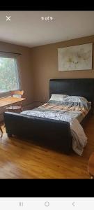 a bedroom with a large bed in a room at Very large room in Montreal