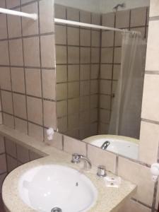 a bathroom with a sink and a mirror at Cabañas Santa Catalina in Tilcara +19 photos