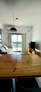 En eller flere senge i et værelse på Edificio Aura con cochera, A mts del shopping, casino y el puerto!!