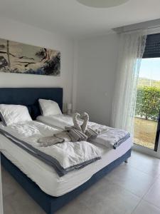 a bed with a person laying on top of it at Mijas Tres Caminos in La Cala de Mijas +48 photos