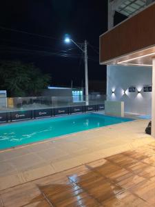 an empty swimming pool at night at Honório Pousada-Caldas do Jorro BA in Tucano