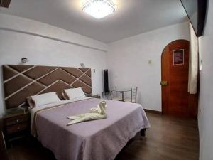 Llit o llits en una habitació de Princess Hotel