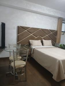 Llit o llits en una habitació de Princess Hotel